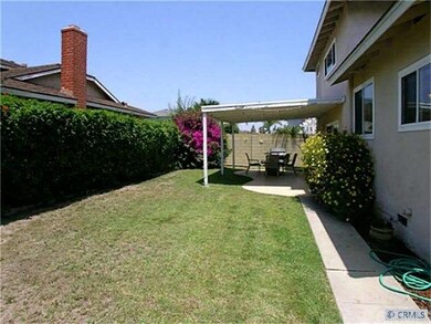 Large backyard with covered patio, great for enter
