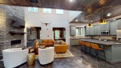 Living room featuring wooden ceiling, a fireplace,