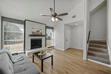 Living room featuring ceiling fan, high vaulted ce