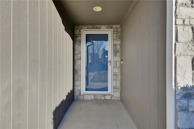 View of exterior entry with stone siding