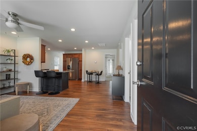 Living room featuring dark wood-type flooring and