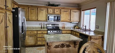 Kitchen with appliances with stainless steel finis