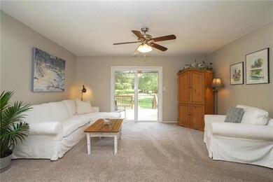 Livingroom with backyard view. New double sliders with built in shades.