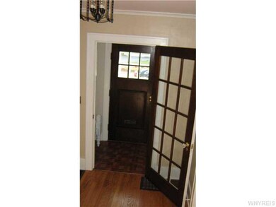 Foyer. One of the many french doors in the house. 