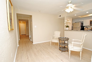 Walk thru the doorway entering a large open Living