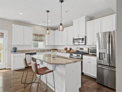 A spacious center island with seating, stylish pen