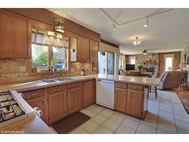Large kitchen with newer appliances and custom bac