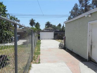 looking down back of garage to RV gate, plenty of 