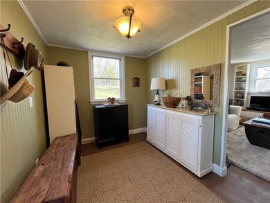 Side entrance room leading to living room