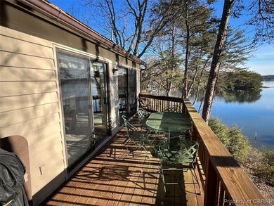 Wooden deck featuring a water view of Wilton Creek