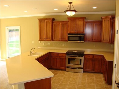 Spacious kitchen opens up to  the breakfast area a