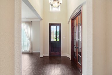 This is the view from the stairs to the front Door. You will notice the height ceilings is throughout this lovely Home.
