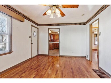 Living room leads to bedrooms and kitchen