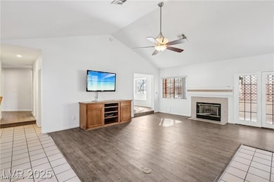 Unfurnished living room featuring a tile fireplace