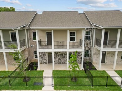 View of building exterior with a fenced front yard