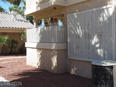 View of side of home with stucco siding, a tiled r