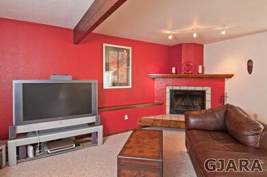 Beautiful stucco and tile fireplace in living room