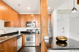 Kitchen featuring appliances with stainless steel