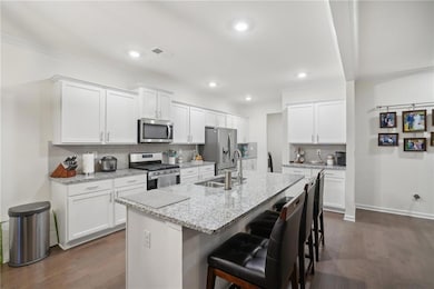 Kitchen with sink, stainless steel appliances, an 