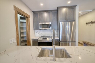 Kitchen featuring tasteful backsplash, lvp floorin