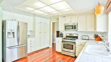 Kitchen View with stainless steal appliances tile 