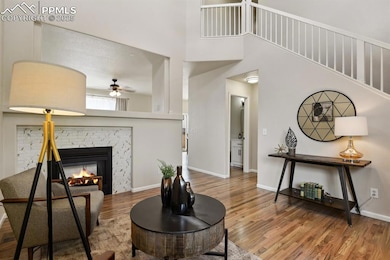 Living area with wood finished floors, a ceiling f