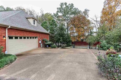 Large driveway. Inside garage has 3 storage rooms 