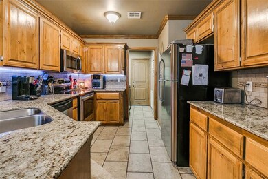Kitchen with appliances with stainless steel finis