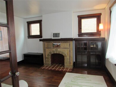 living room with decorative fireplace and built-in