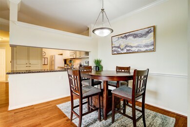 Dining are with view into kitchen.