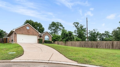 Generous driveway with a welcoming front yard.