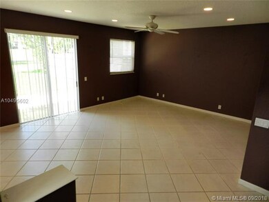 Living room with sliding door out to backyard