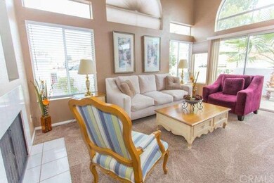 Living room has vaulted ceiling, fireplace and sli