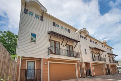 This photo features a row of modern three-story to