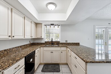 Granite Counters & Window to the pool