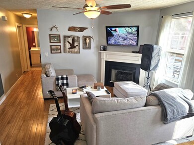 Living area with fireplace and back deck access