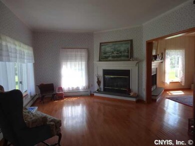 Living Room Gleaming hardwoods and nice corner fir