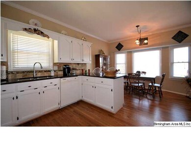Breakfast bar seperates the eating area with bay w