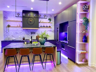 Bar with pendant lighting, paneled fridge, oven, d