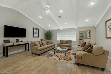 Living room featuring light wood-style floors, a c