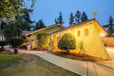 2 car garage is tucked behind th slanted wall