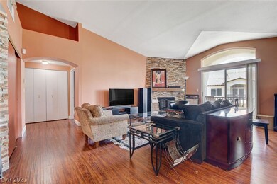 Spacious living room with stone veneer on gas fire