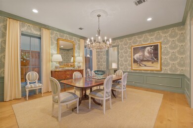 Stunning dining room accented with a 12 light chan