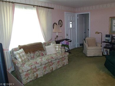 Living room features custom-made drapes.  From her