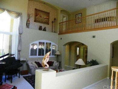 Living Room with View of Second Floor Hallway