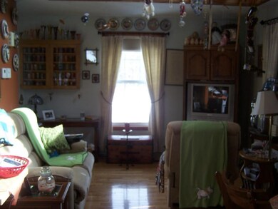 Cozy living room with cathedral...