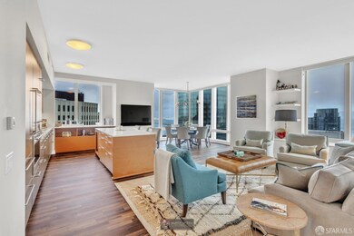 An expansive great room with floor-to-ceiling views offers the perfect balance of comfort and sophistication—ideal for both lively gatherings and quiet evenings in.