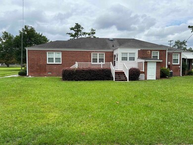 Back of property with a deck, cooling unit, and a 