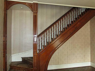 Living Room. Main staircase leading to the second 
