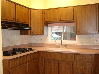 equipped eat-in-kitchen, with corian counter, cera